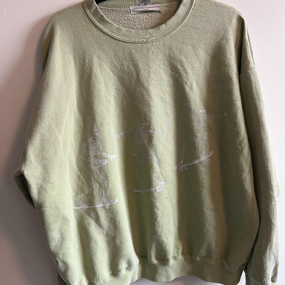 Sage green Urban Outfitters crewneck with skateboarding skeletons